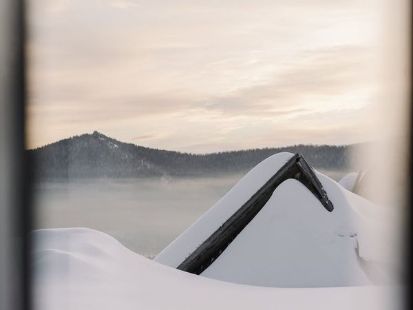 Silhouette of a person meditating at sunrise.